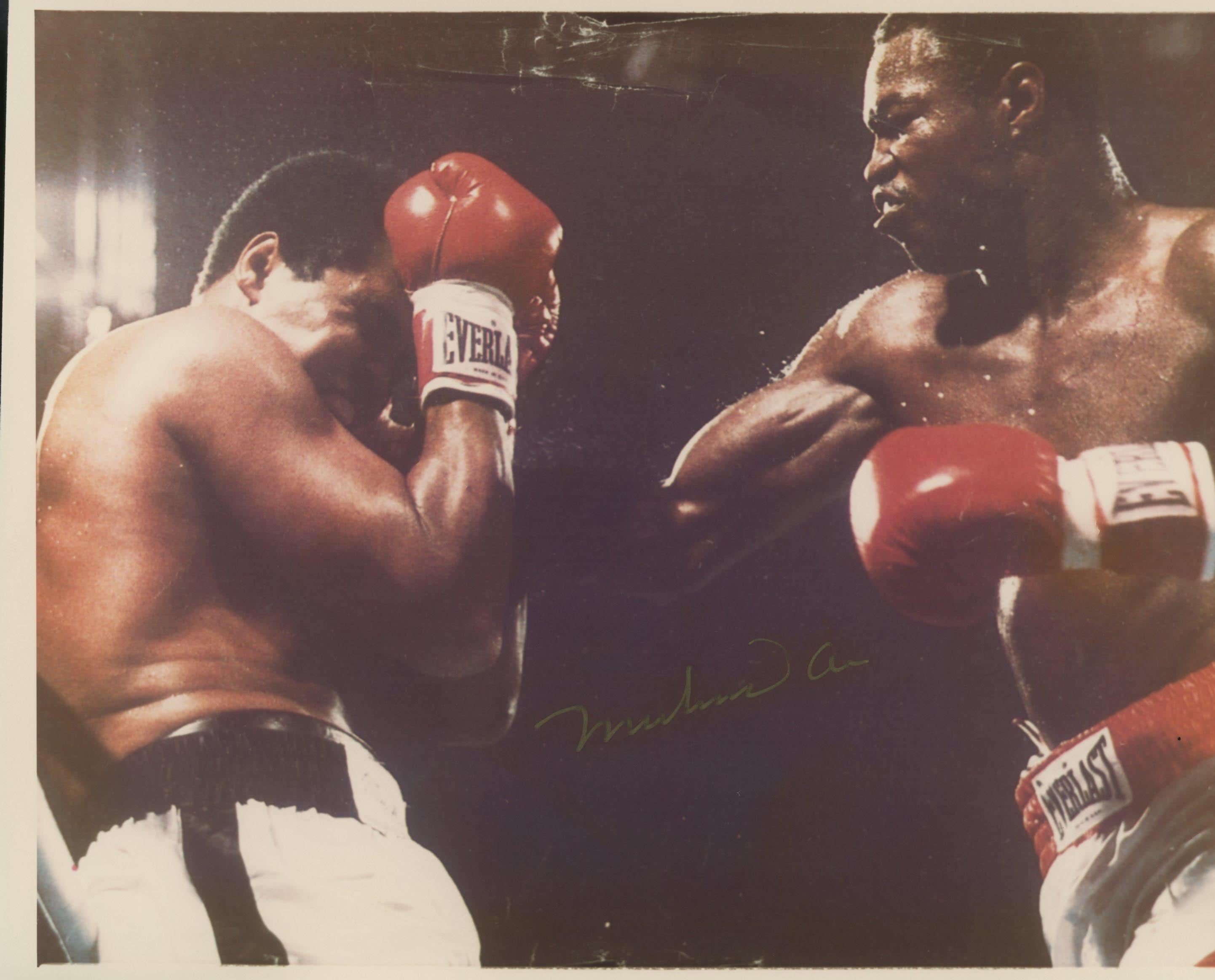 Muhammad Ali signed photo. GFA Authenticated