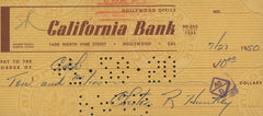 Evening News Anchor Chester Huntley signed check