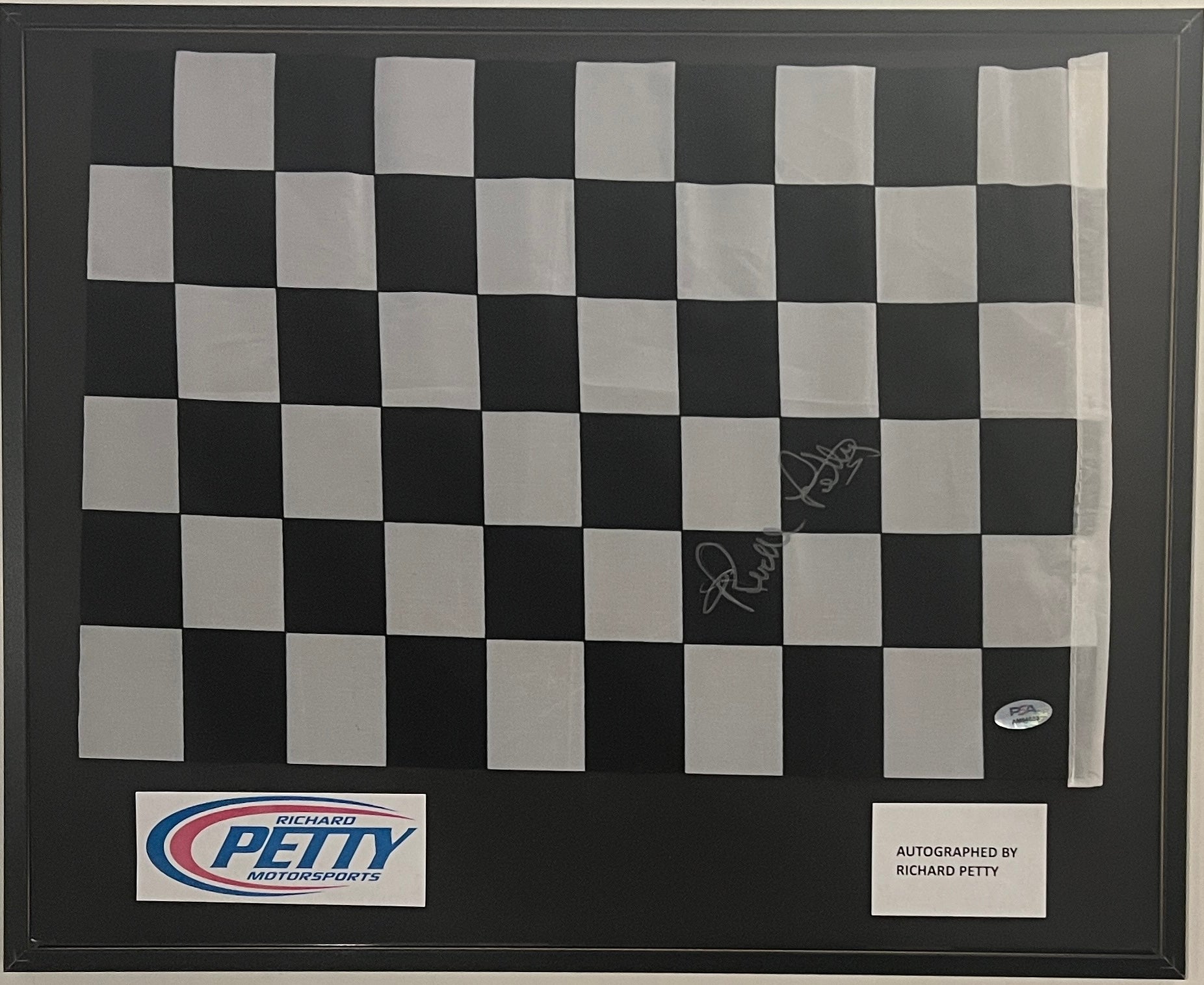 Richard Petty signed checkered flag. PSA authenticated