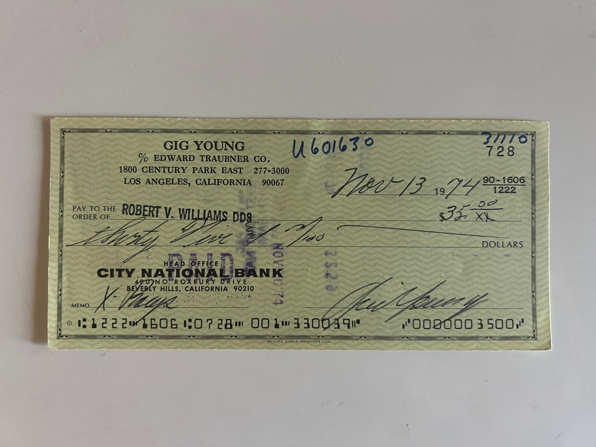 Gig Young signed check