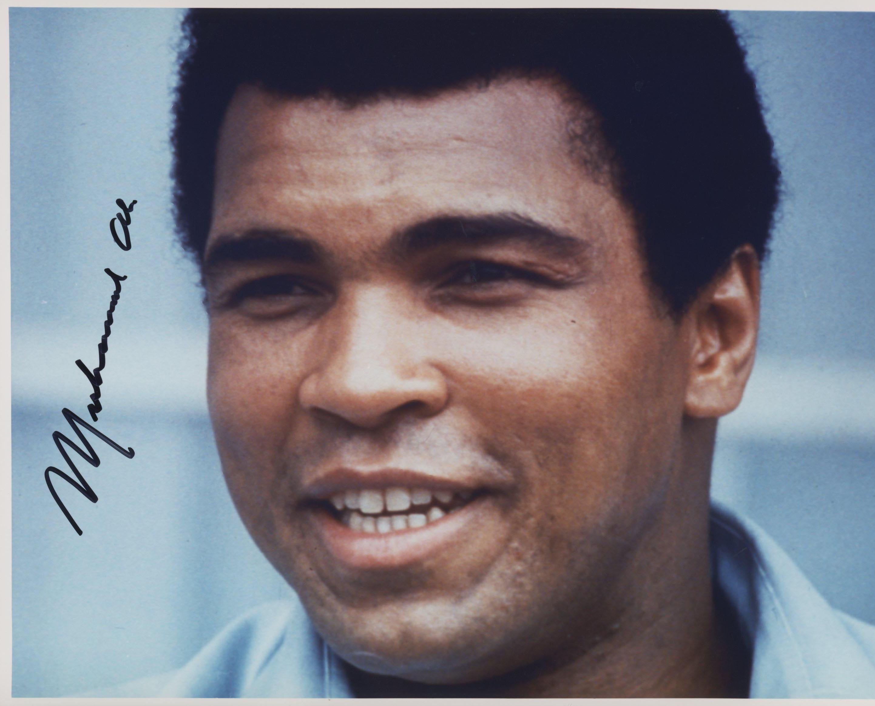Muhammad Ali signed photo. GFA Authenticated