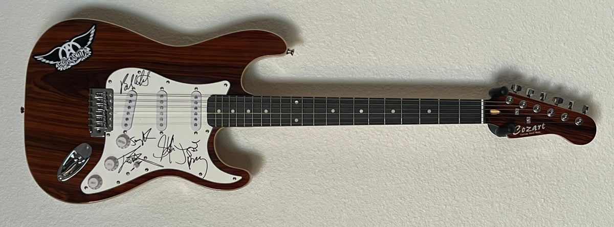 Aerosmith band signed wood grain Stratocaster style guitar
