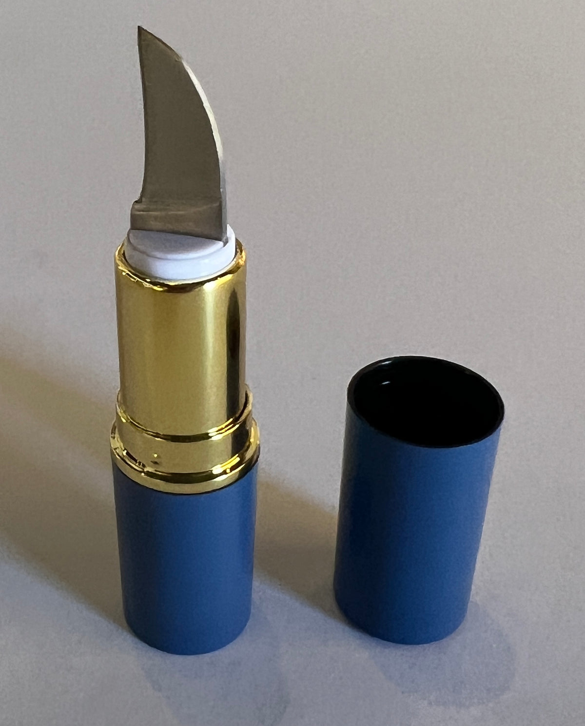 Lipstick case pocket knife prop