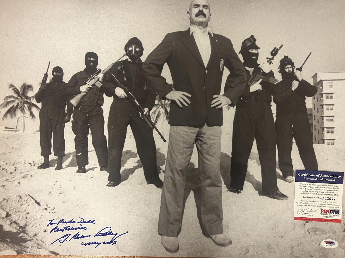 G. Gordon Liddy signed photo. PSA